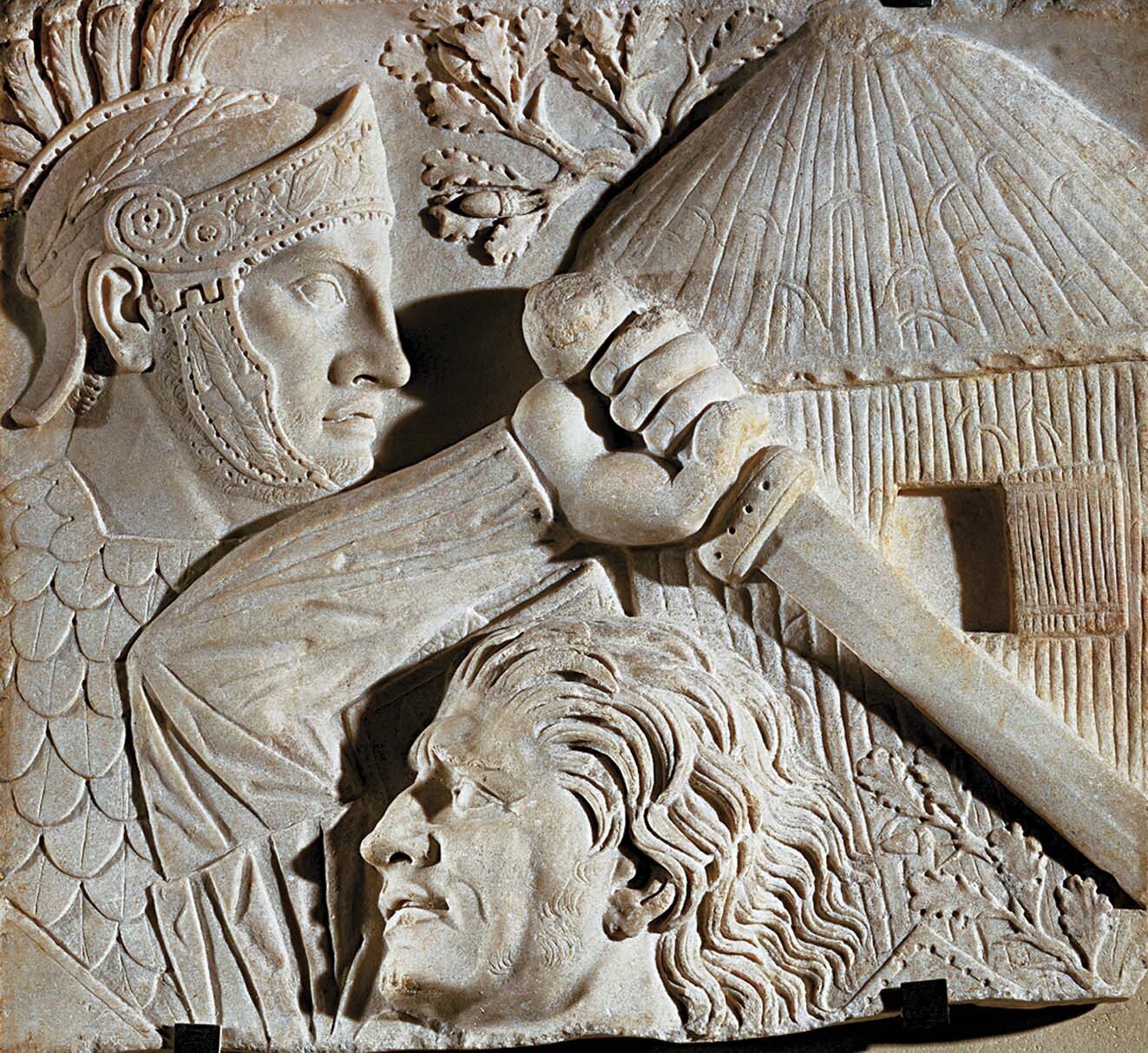 A stone carving of a Roman legionary soldier and a German fighter.