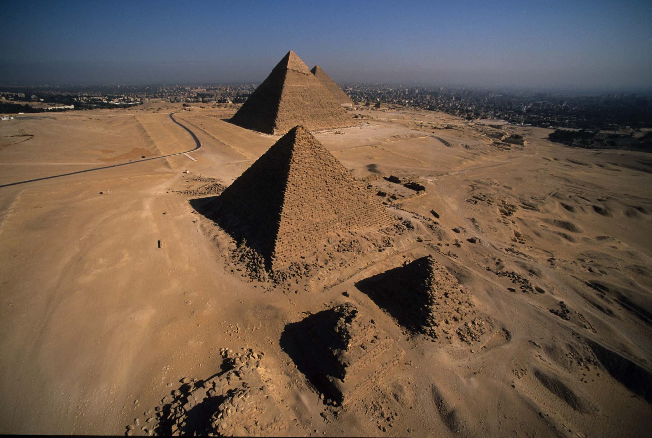 The Pyramid Fields of Giza, which has three small pyramids in the front and three large pyramids in the back.