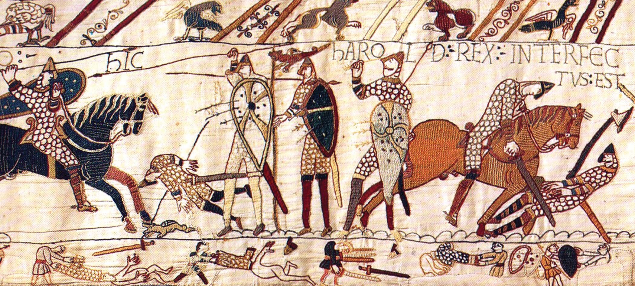 An photo of part of the Bayeux Tapestry shows several figures engaged in battle.