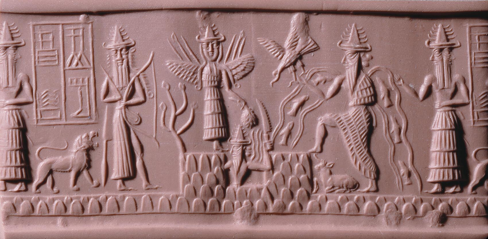 The Greenstone seal of Adda with many gods. Multiple horns are present on their pointed hats.