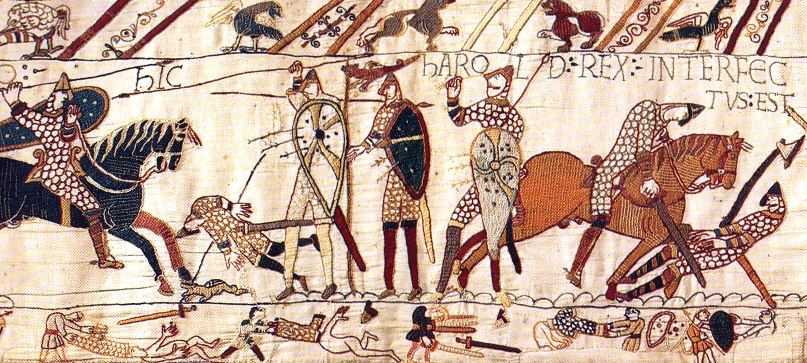 An photo of part of the Bayeux Tapestry shows several figures engaged in battle.
