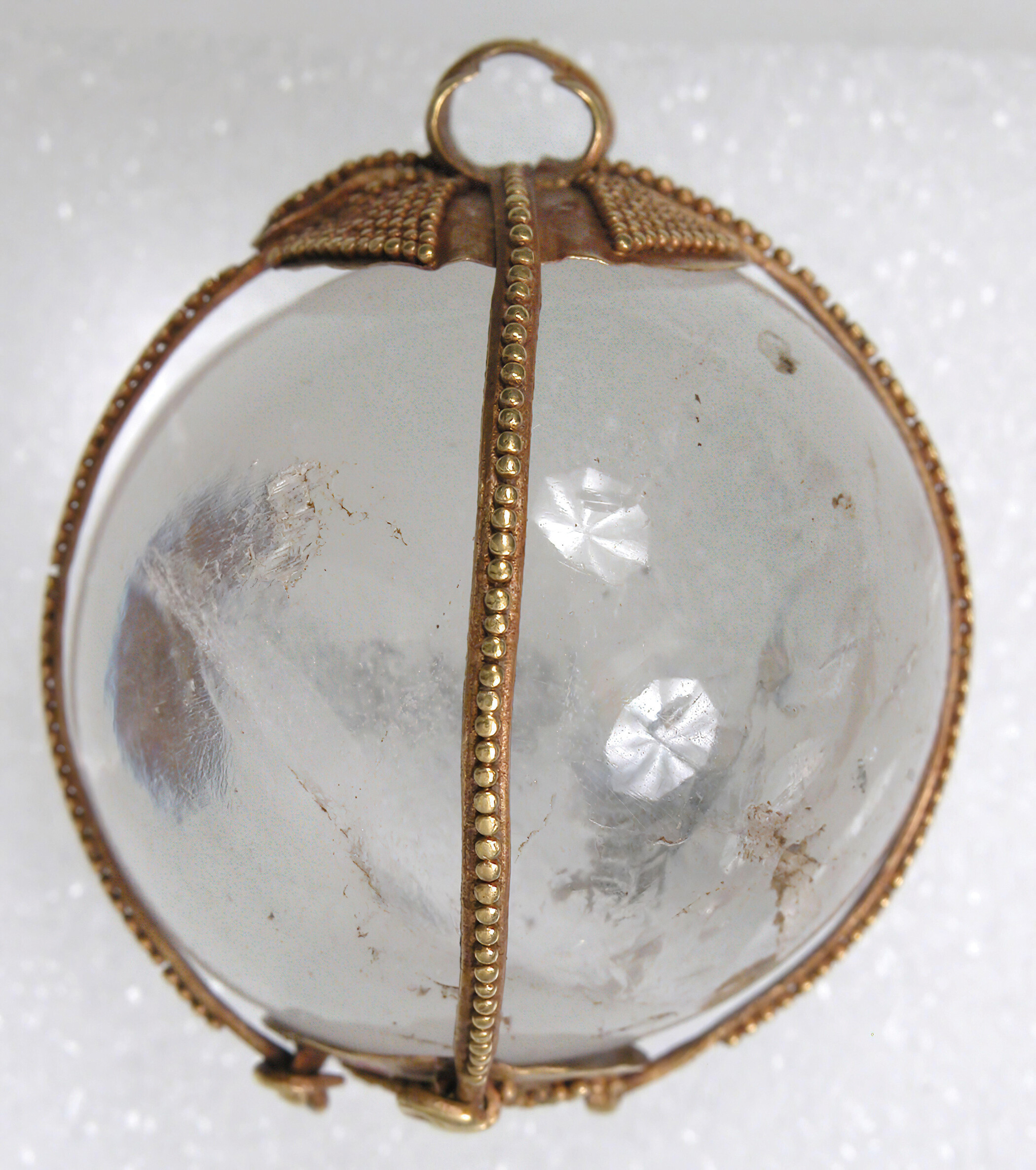 Rock crystal sphere set in gold as a pendant, worn as an amulet by the Huns.
