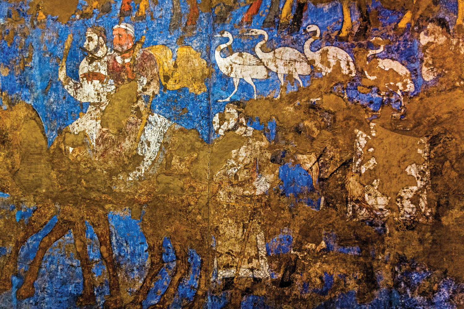 Ancient wall painting showing a procession of riders on animals during a celebration in Afrasiab.