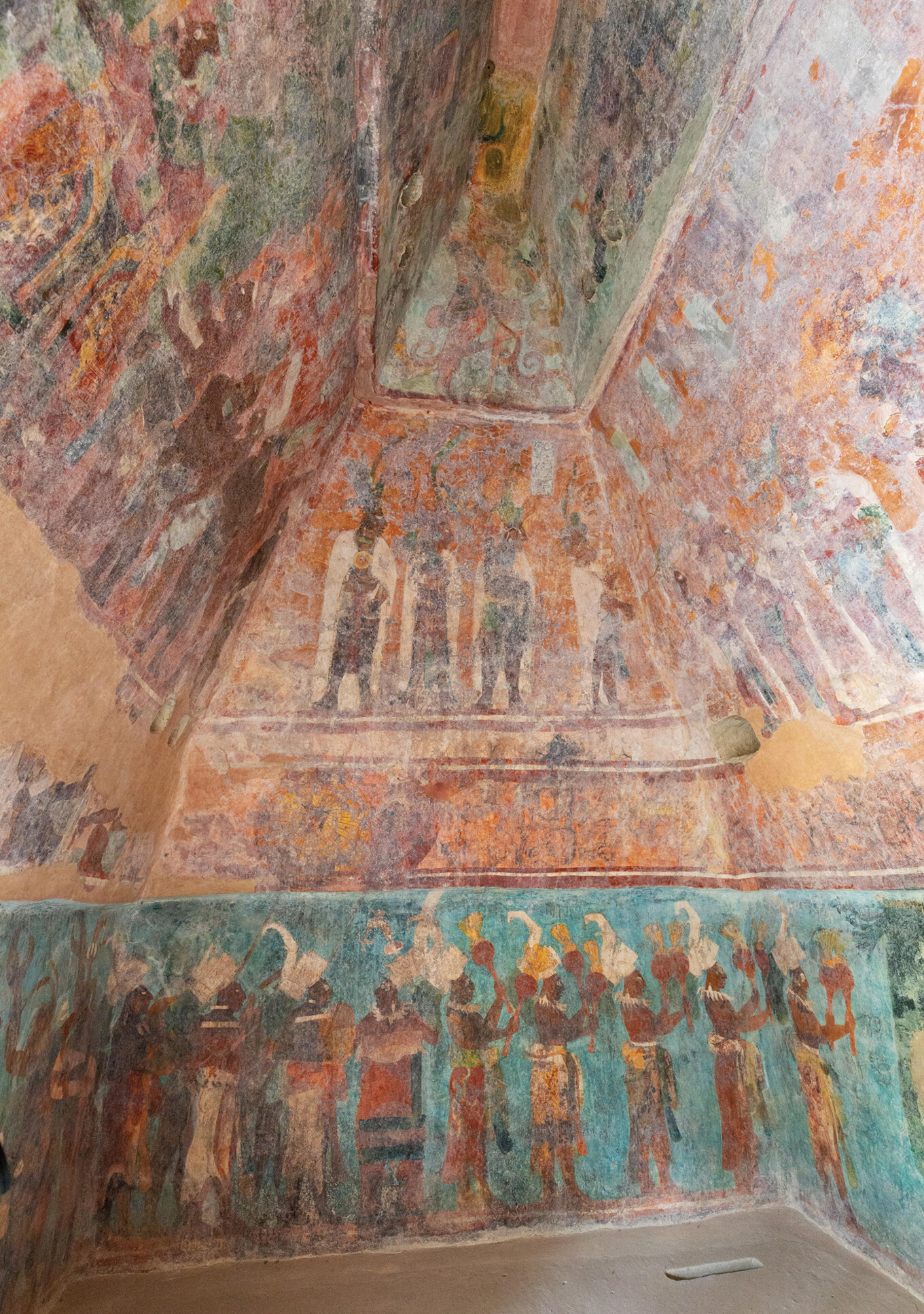 Bonampak mural showing Maya nobles above and musicians performing in a ceremonial procession below.